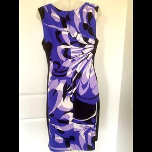 Woman’s purple flowered sleeveless dress. Knee length